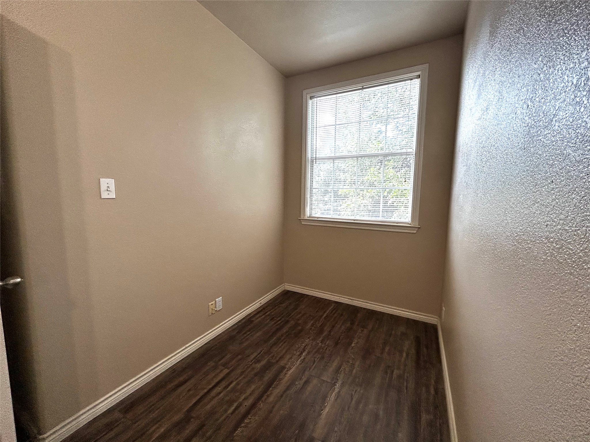 408 Nelray Boulevard, Unit A Austin, TX 78751 - Photo 30 of 36 an empty room with wooden floor and windows