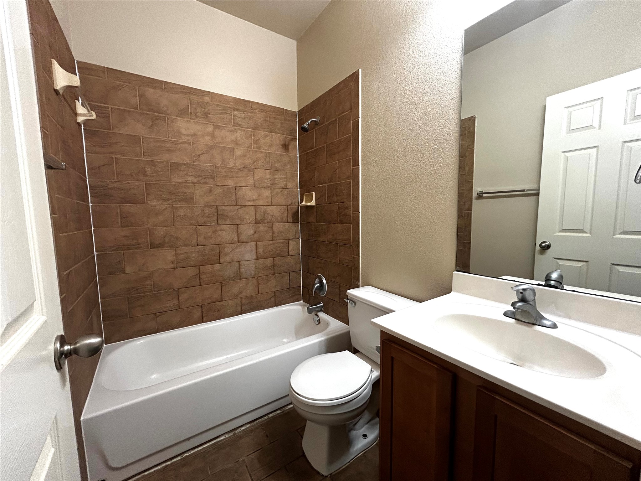 408 Nelray Boulevard, Unit A Austin, TX 78751 - Photo 31 of 36 a bathroom with a sink a toilet and a bathtub
