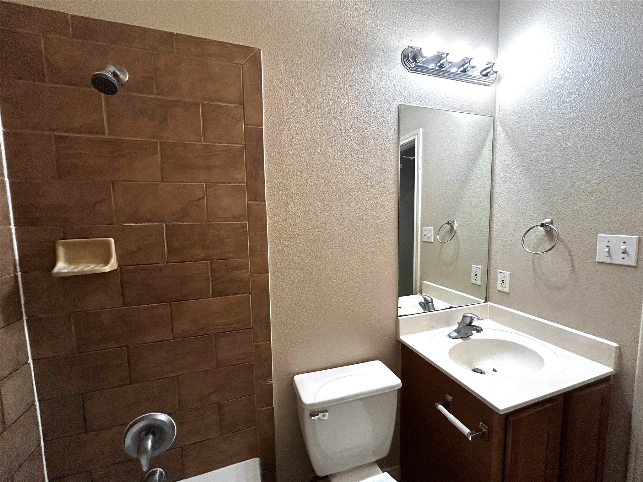 408 Nelray Boulevard, Unit A Austin, TX 78751 - Photo 32 of 36 a bathroom with a sink a toilet and a mirror