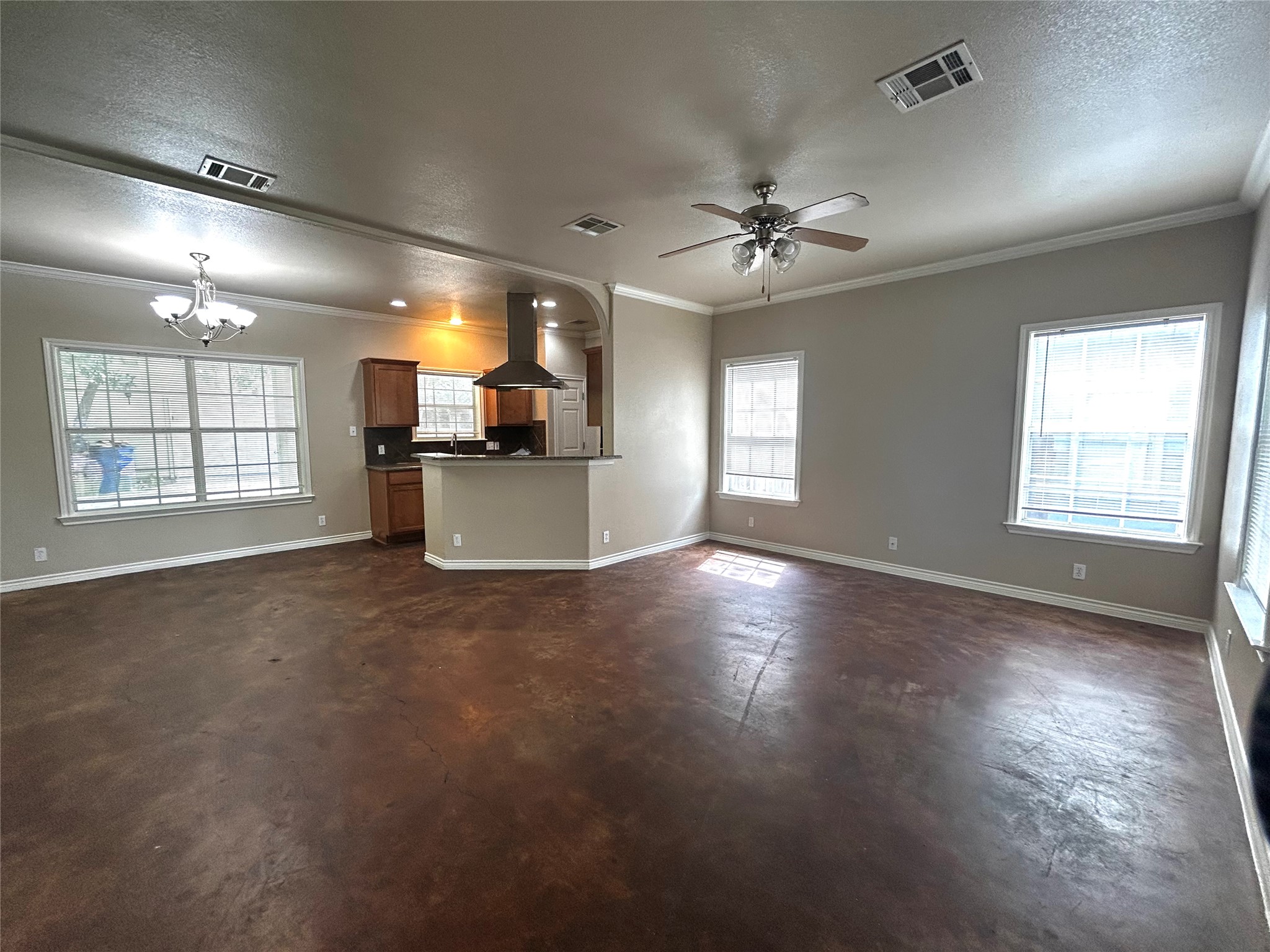 408 Nelray Boulevard, Unit A Austin, TX 78751 - Photo 5 of 36 an empty room with windows and ceiling fan