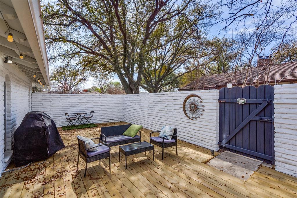 15642 Overmead Circle Dallas, TX 75248 - Photo 21 of 24 a view of a chairs and table in backyard