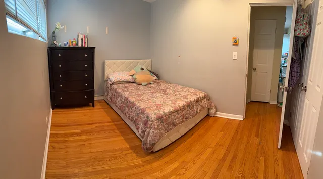 a bedroom with a bed and a walk in closet