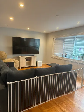 a view of a living room and a flat screen tv