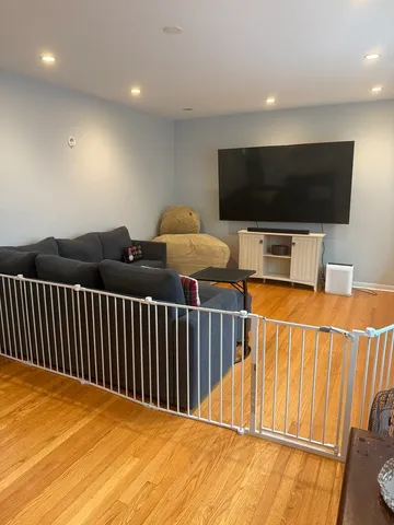 a view of a livingroom with furniture and a flat screen tv