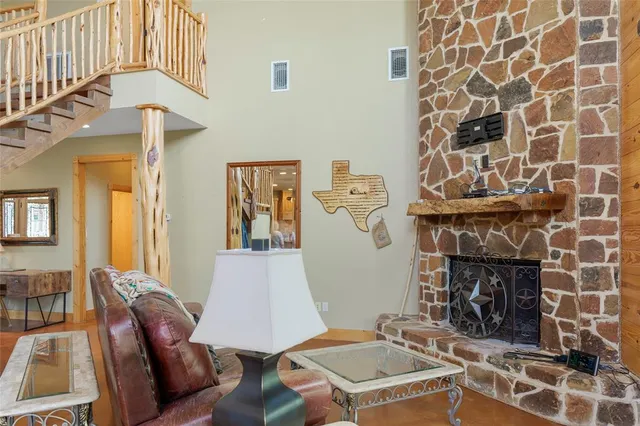 a view of a livingroom with furniture and stairs