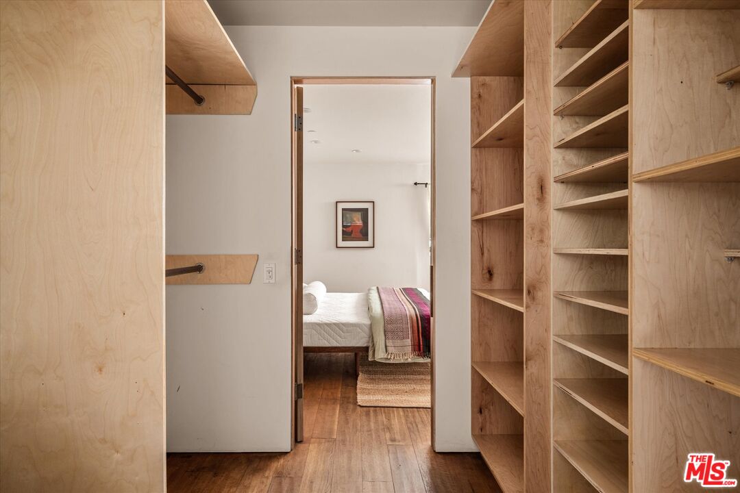 1072 Montecito Drive Los Angeles, CA 90031 - Photo 11 of 30 a view of walk in closet with clothes and shoes