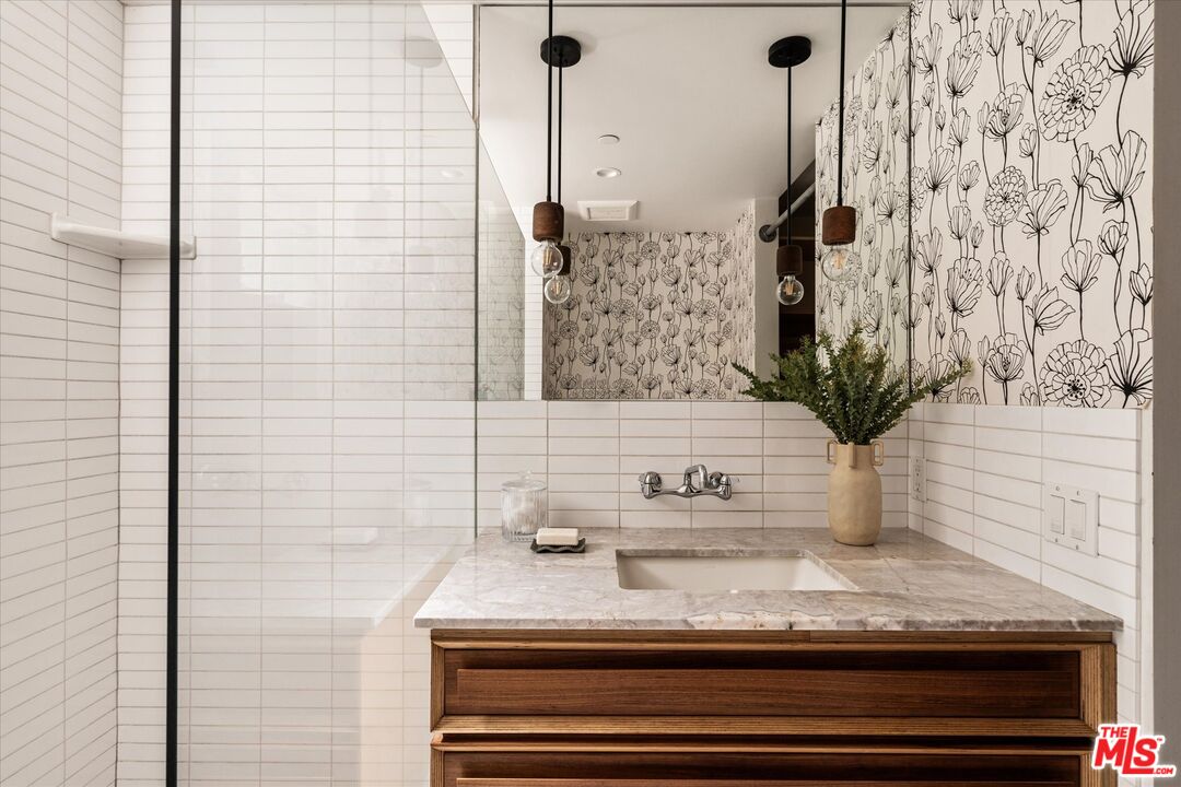 1072 Montecito Drive Los Angeles, CA 90031 - Photo 12 of 30 a bathroom with a sink and a mirror