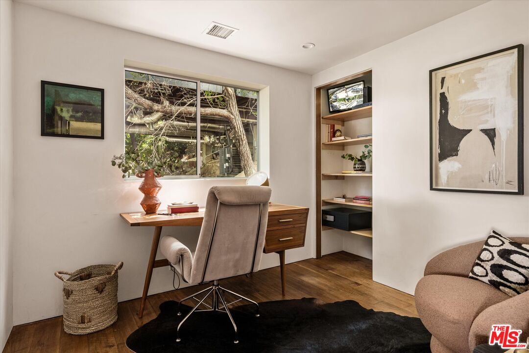1072 Montecito Drive Los Angeles, CA 90031 - Photo 13 of 30 a view of a workspace with furniture and window