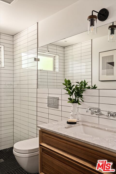 1072 Montecito Drive Los Angeles, CA 90031 - Photo 19 of 30 a bathroom with a toilet a sink and mirror