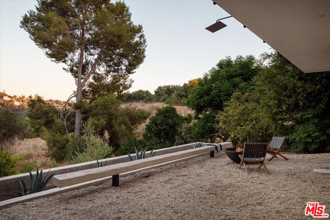 1072 Montecito Drive Los Angeles, CA 90031 - Photo 20 of 30 a roof deck with table and chairs and a potted plant
