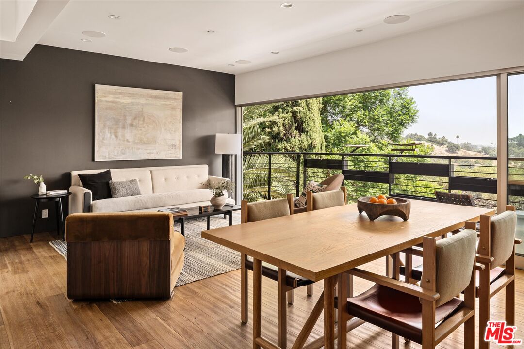 1072 Montecito Drive Los Angeles, CA 90031 - Photo 6 of 30 a living room with furniture a large window and wooden floor