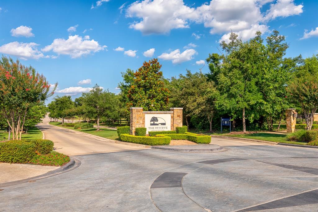 7013 Handel Colleyville, TX 76034 - Photo 5 of 37 Stone-clad monument signage with manicured shrubbery