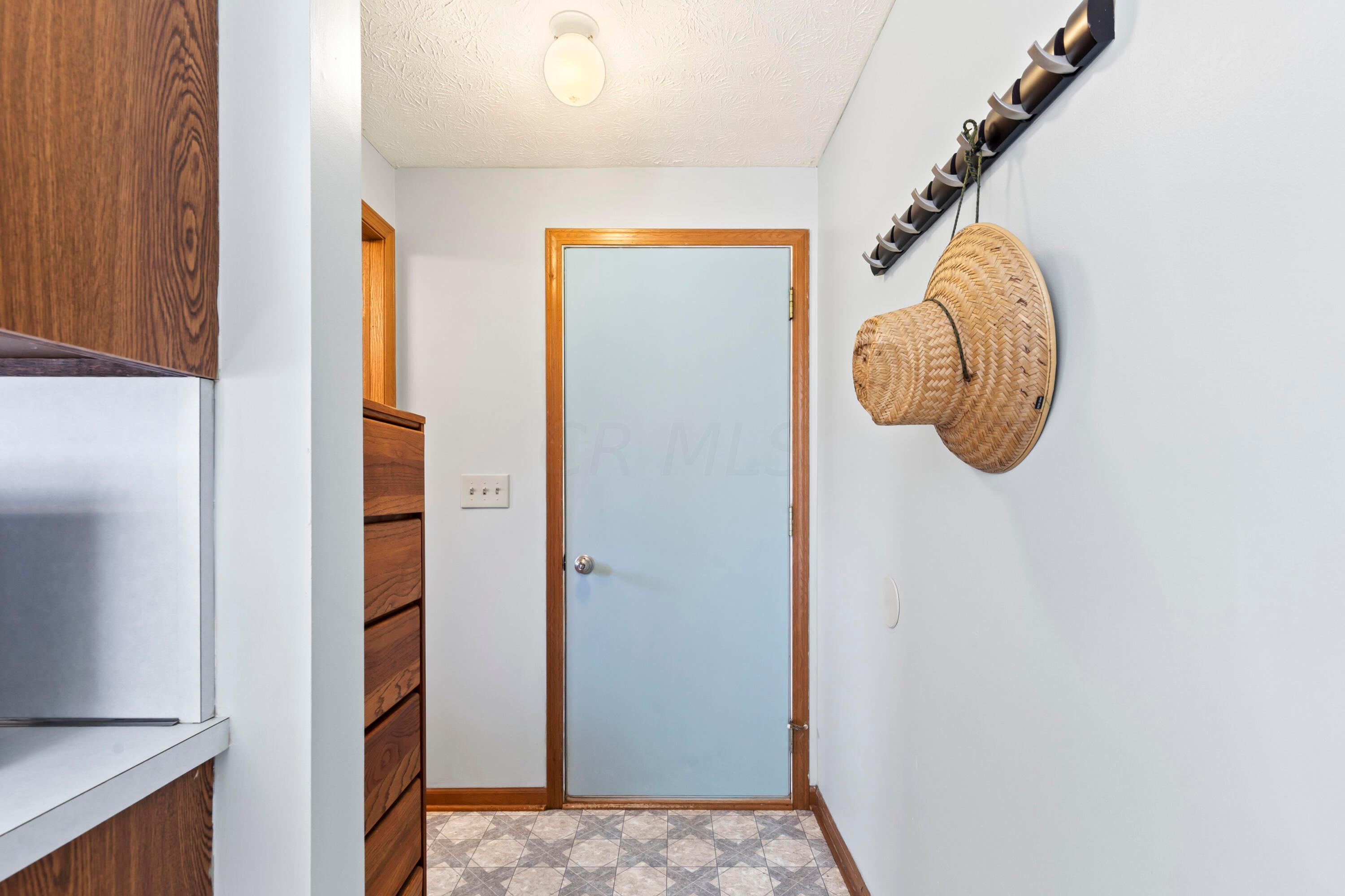 14040 Downing Road Croton, OH 43013 - Photo 28 of 66 • Neutral vinyl flooring
• Tan painted walls
• Ceiling light