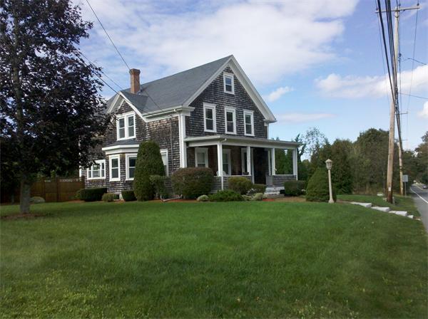 562 Reed Road Dartmouth, MA 02747 - Photo 1 of 12 a front view of a house with a garden