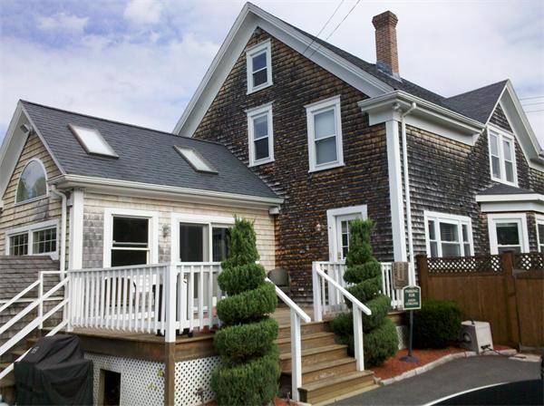 562 Reed Road Dartmouth, MA 02747 - Photo 3 of 12 a front view of a house with a porch