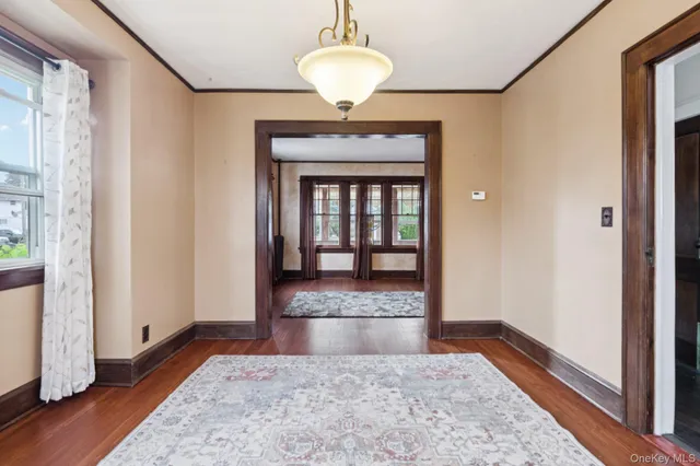 a view of front door with chandelier