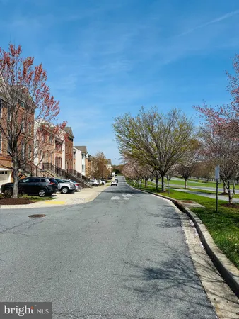 a view of a street with a building in the background