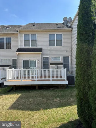 a view of a yard with a deck and a yard