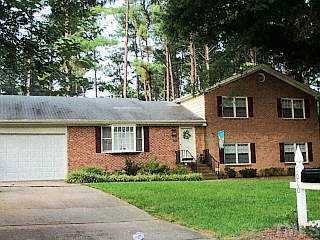 1010 Country Ridge Drive Raleigh, NC 27609 - Photo 1 of 1 front view of a house with a yard