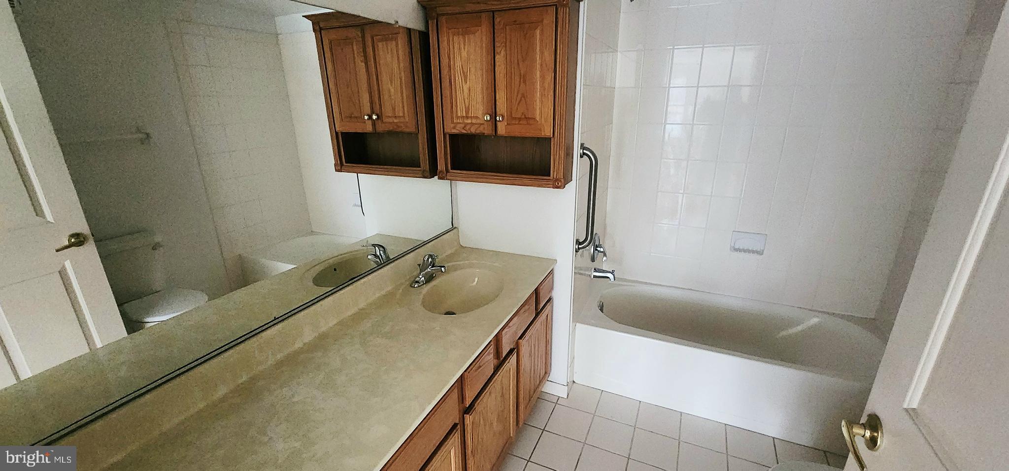 1864 Gibson Road Bensalem, PA 19020 - Photo 11 of 20 a bathroom with a tub sink and mirror