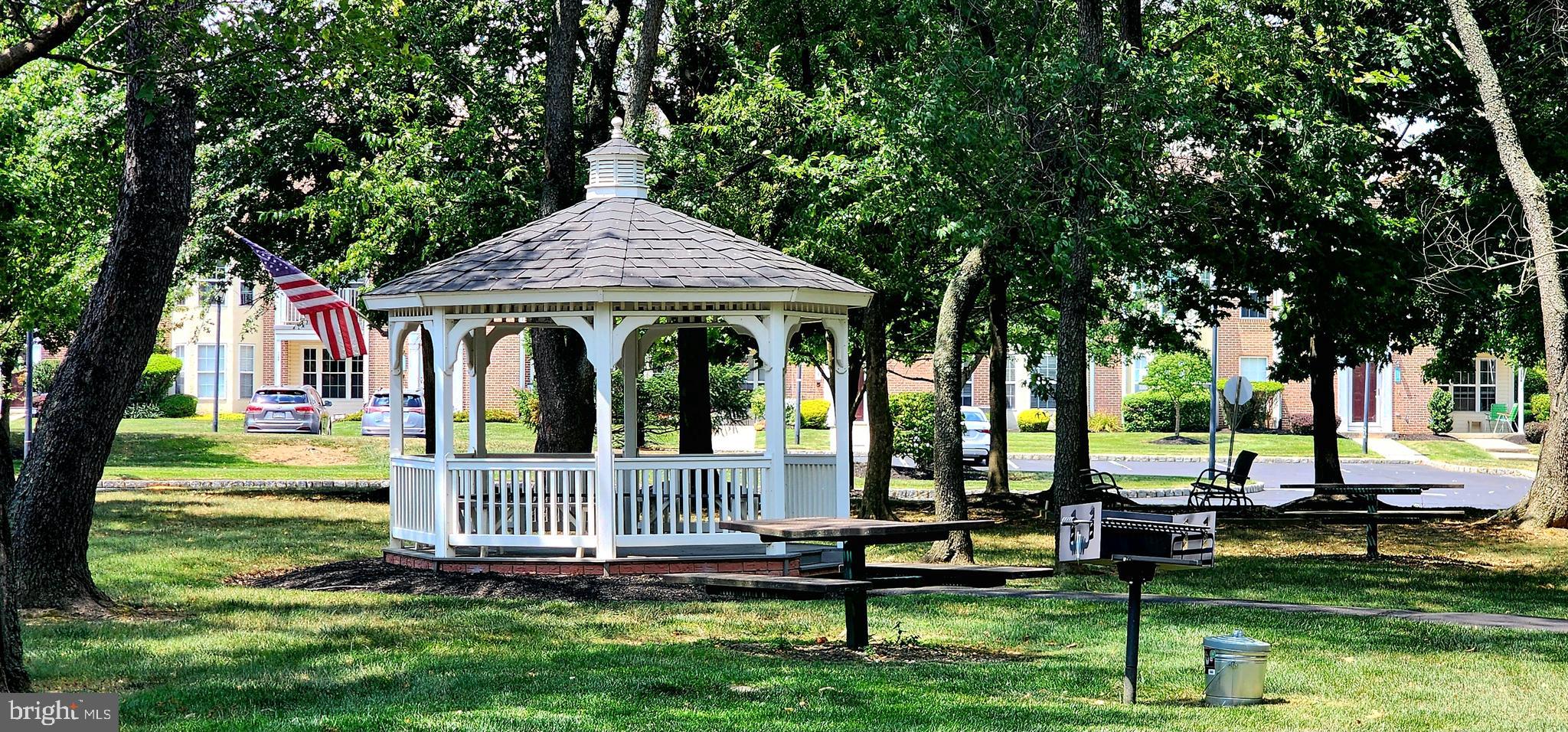 1864 Gibson Road Bensalem, PA 19020 - Photo 19 of 20 a front view of a house with a yard table and chairs