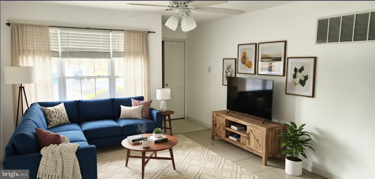 1864 Gibson Road Bensalem, PA 19020 - Photo 3 of 20 a living room with furniture and a flat screen tv
