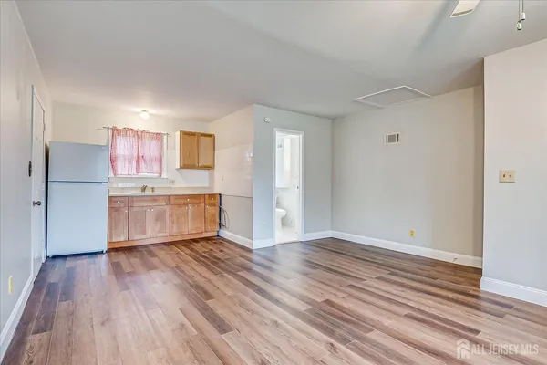 a view of kitchen with wooden floor