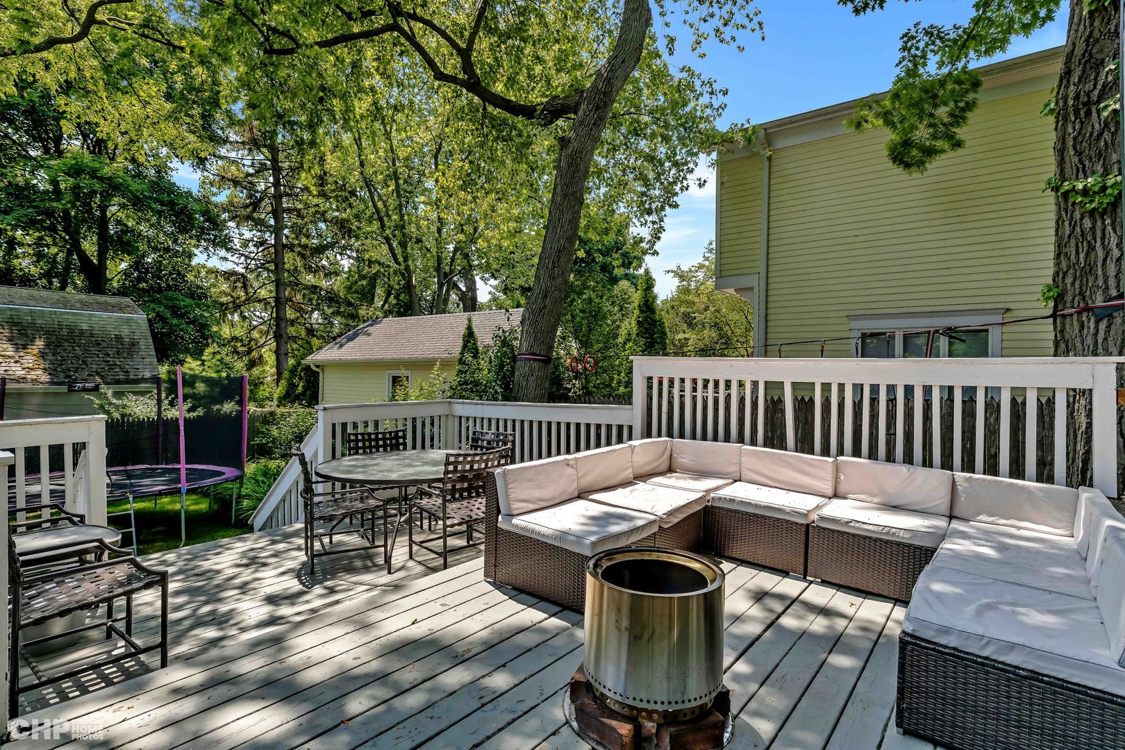 936 Spruce Street Winnetka, IL 60093 - Photo 20 of 38 a view of a chairs and table on the deck