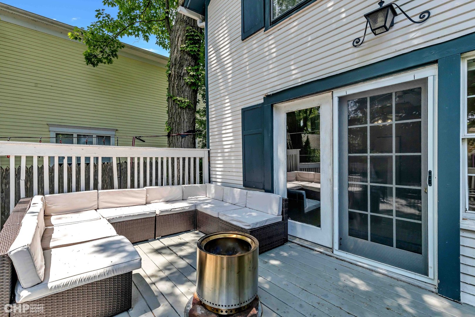 936 Spruce Street Winnetka, IL 60093 - Photo 21 of 38 a view of a deck with wooden floor and floor to ceiling window