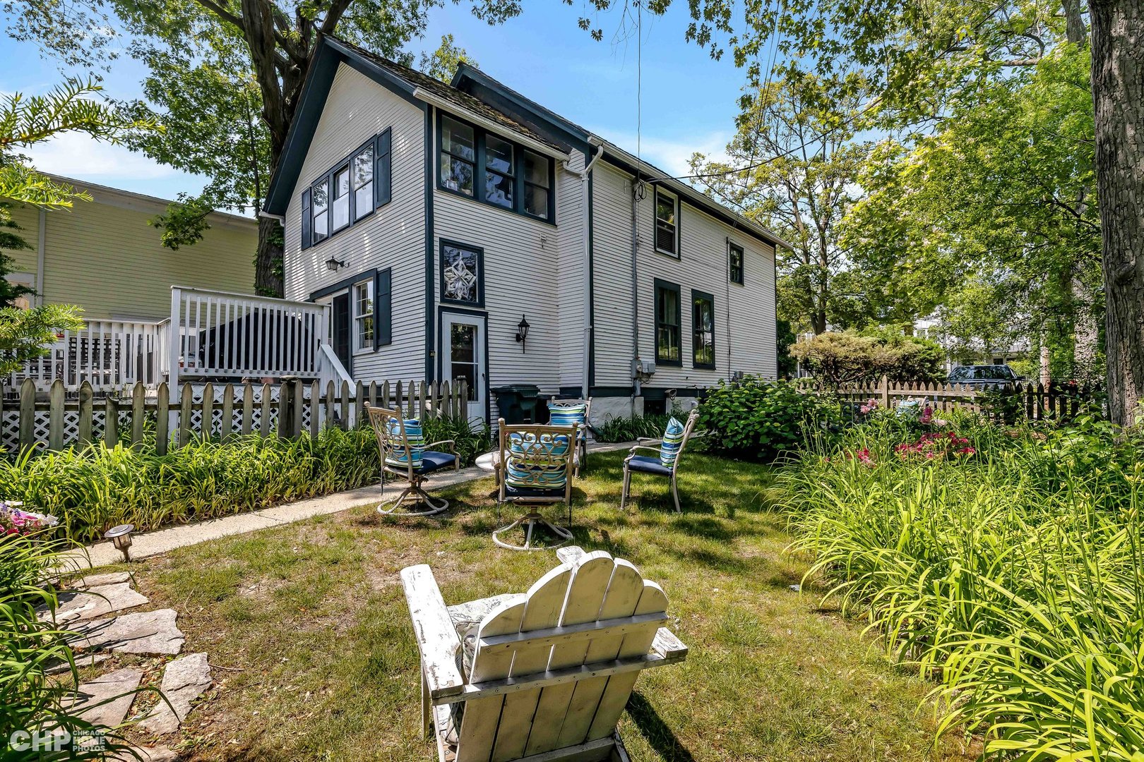 936 Spruce Street Winnetka, IL 60093 - Photo 24 of 38 a front view of a house with garden