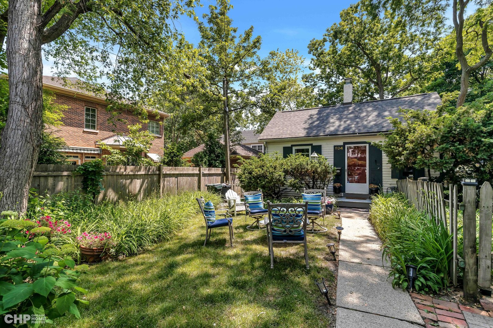 936 Spruce Street Winnetka, IL 60093 - Photo 25 of 38 a front view of house with yard and outdoor seating
