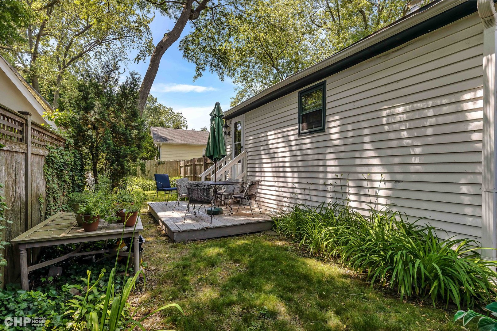 936 Spruce Street Winnetka, IL 60093 - Photo 30 of 38 a backyard of a house with seating space