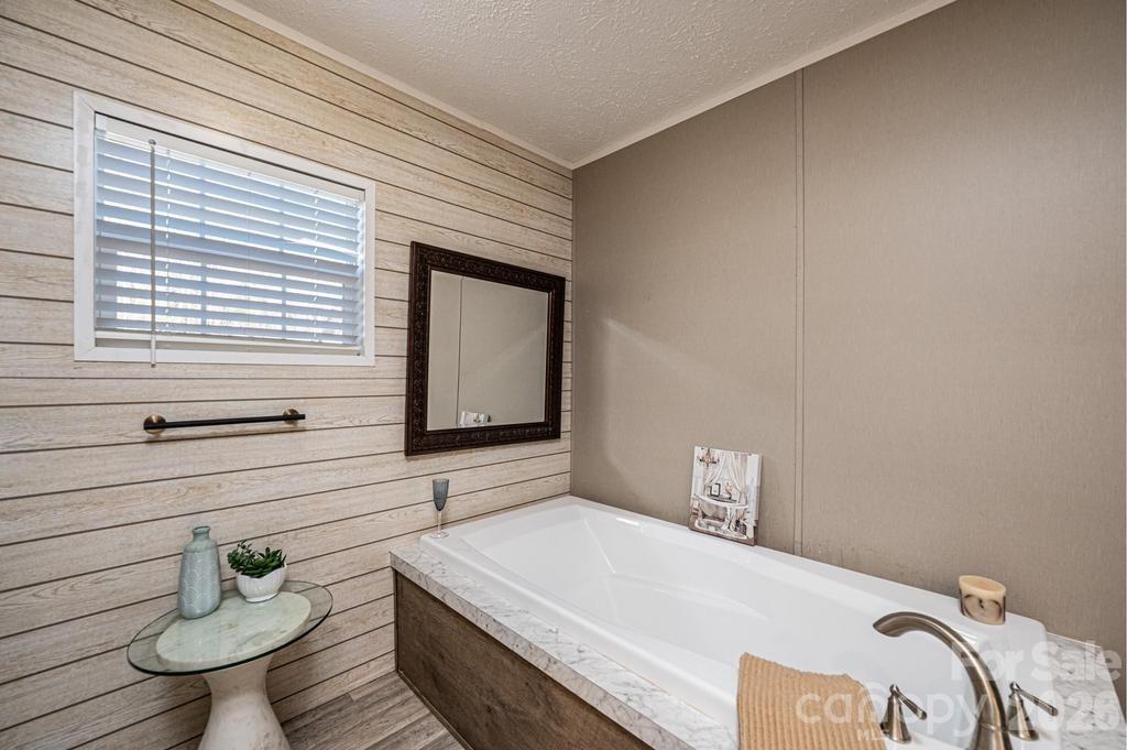 1070 Cottrell Hill Road Lenoir, NC 28645 - Photo 20 of 41 a bedroom with a bed and window