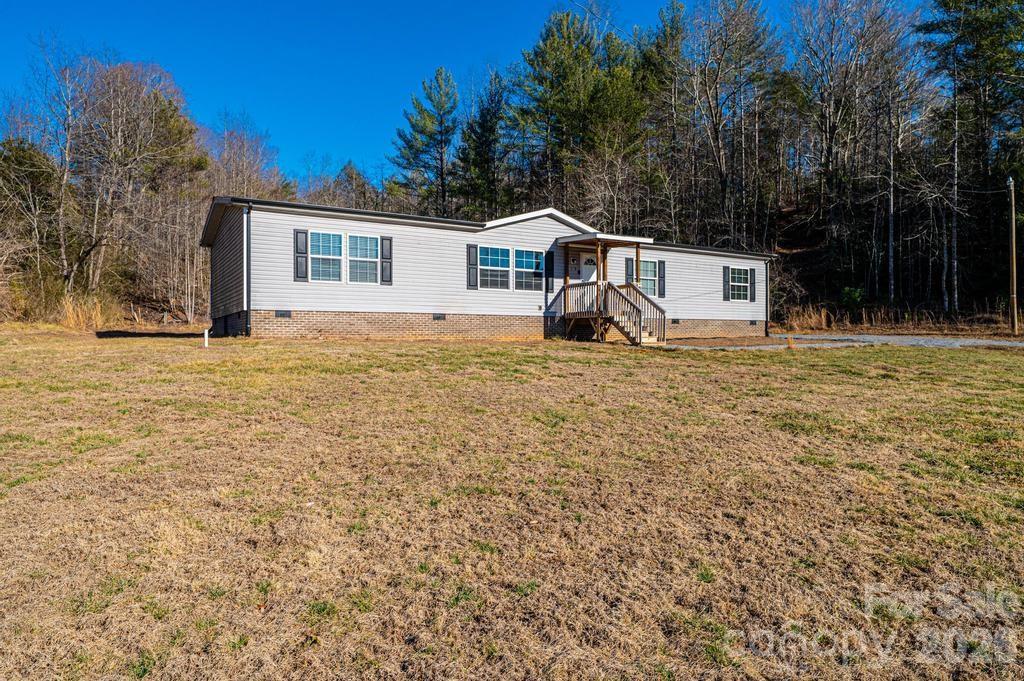 1070 Cottrell Hill Road Lenoir, NC 28645 - Photo 2 of 41 a front view of a house with a yard