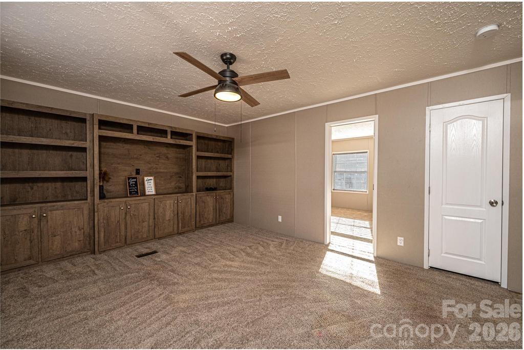 1070 Cottrell Hill Road Lenoir, NC 28645 - Photo 23 of 41 a view of an empty room and cabinet with wooden floor