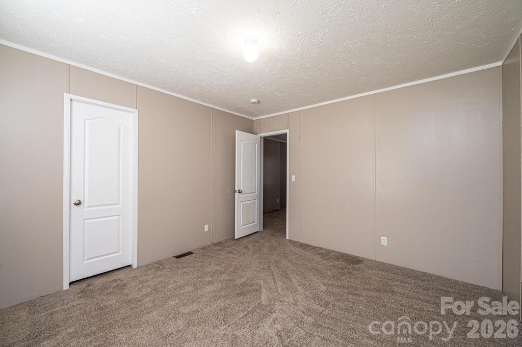 1070 Cottrell Hill Road Lenoir, NC 28645 - Photo 25 of 41 an empty room with an entryway