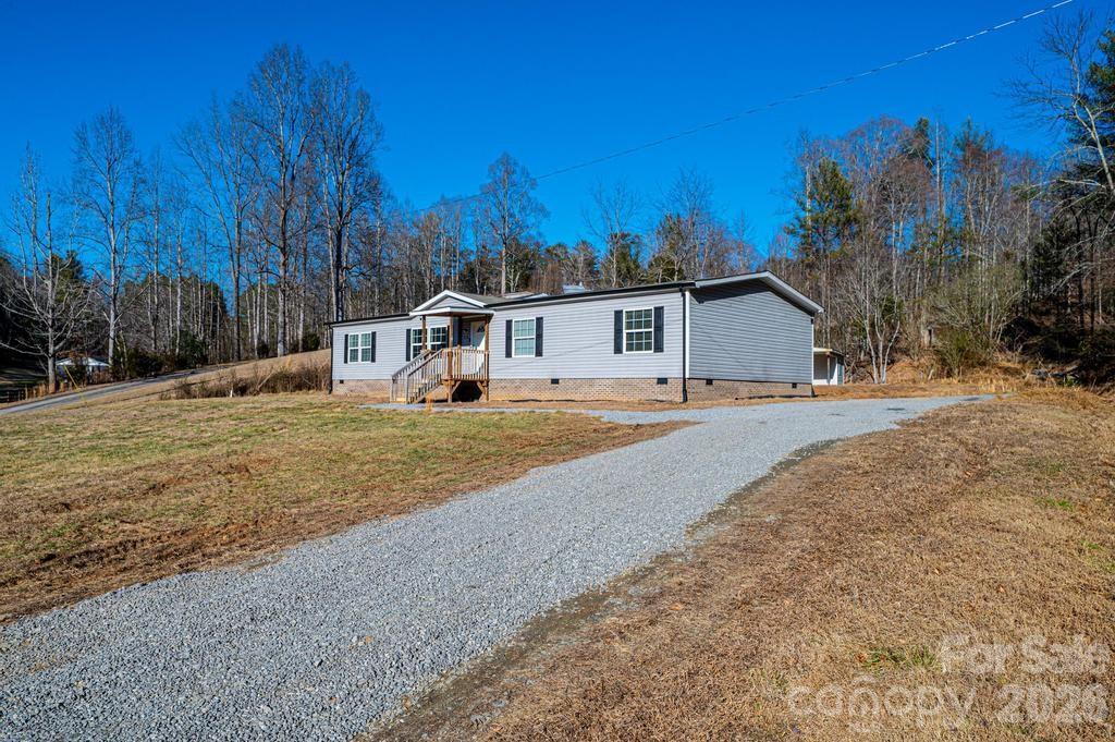 1070 Cottrell Hill Road Lenoir, NC 28645 - Photo 3 of 41 a view of an house with backyard and trees