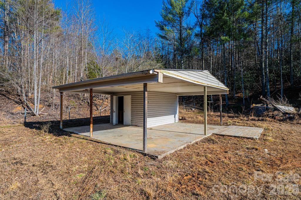 1070 Cottrell Hill Road Lenoir, NC 28645 - Photo 34 of 41 a view of a house with a yard and wooden fence