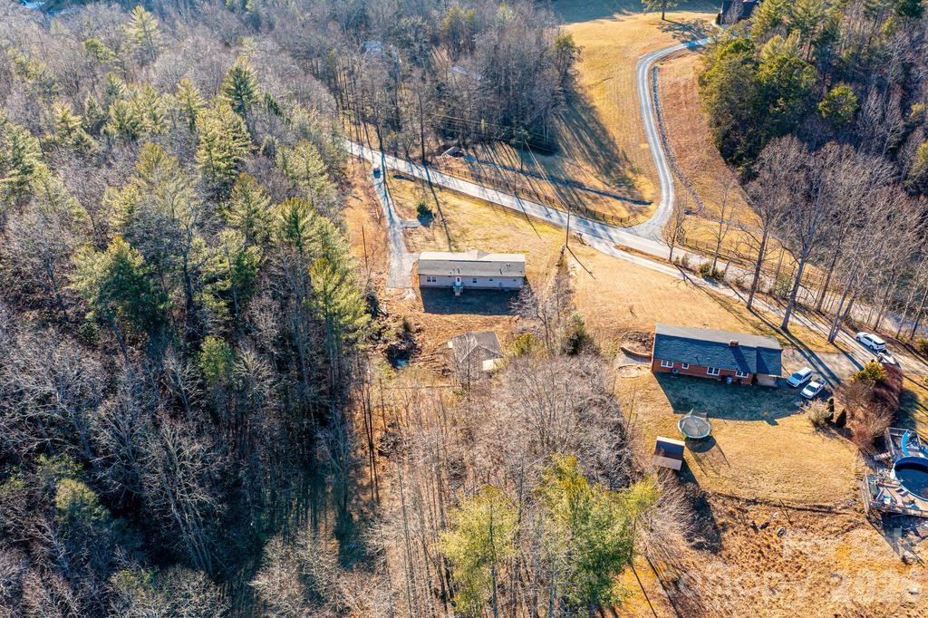 1070 Cottrell Hill Road Lenoir, NC 28645 - Photo 38 of 41 a backyard of a house with large trees
