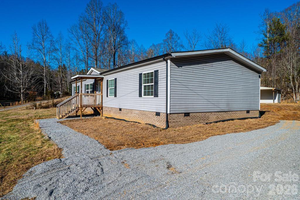 1070 Cottrell Hill Road Lenoir, NC 28645 - Photo 4 of 41 a view of a house with backyard and trees