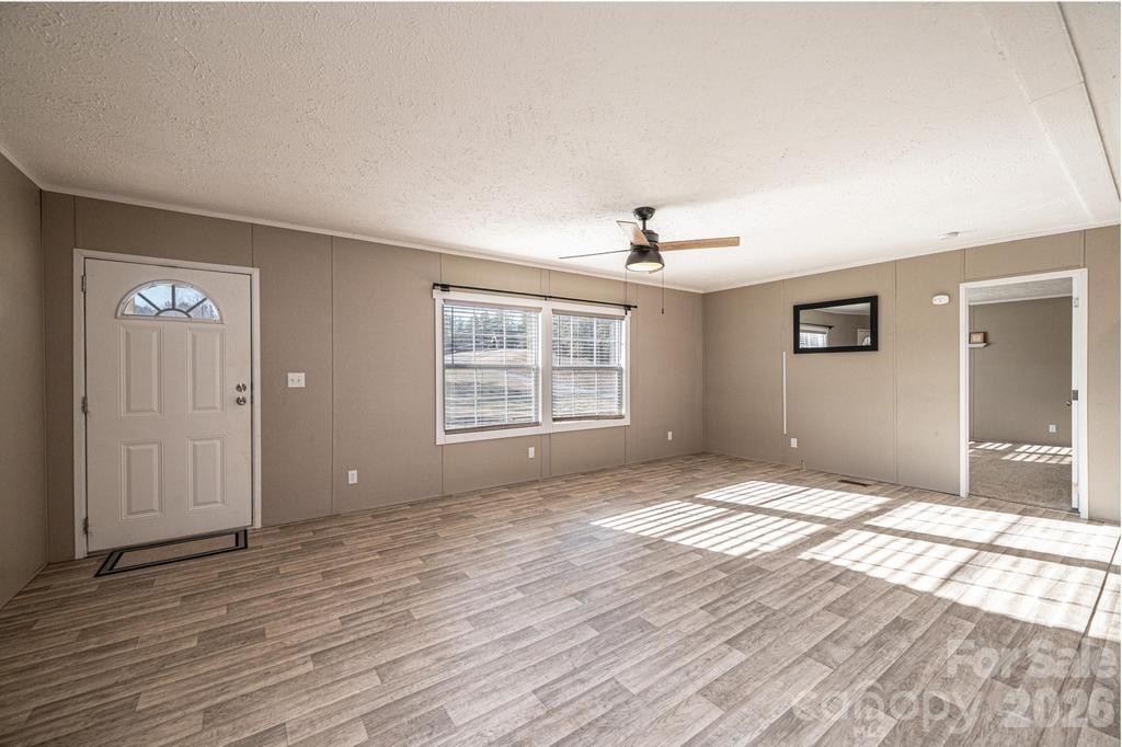 1070 Cottrell Hill Road Lenoir, NC 28645 - Photo 6 of 41 a view of an empty room with window and wooden floor
