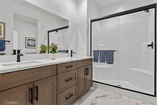 a bedroom with a bed and a desk