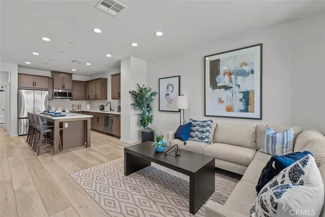a kitchen with stainless steel appliances kitchen island wooden cabinets and granite counter tops