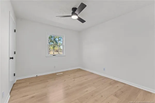 a view of room with ceiling fan