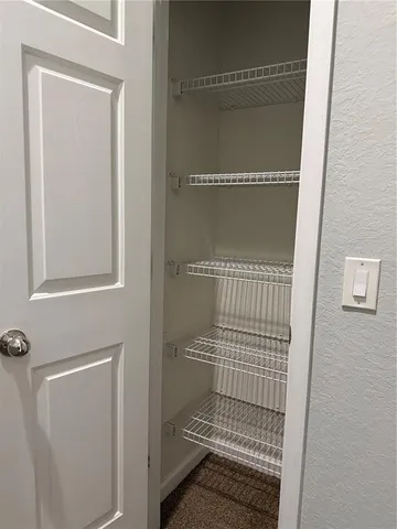 a bathroom with a glass door shower