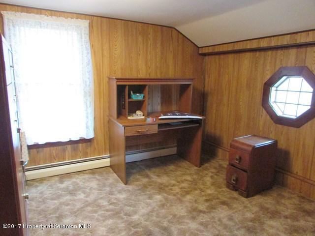 3948 Old Stage Coach Road Wyalusing, PA 18853 - Photo 11 of 19 a room with furniture and a window