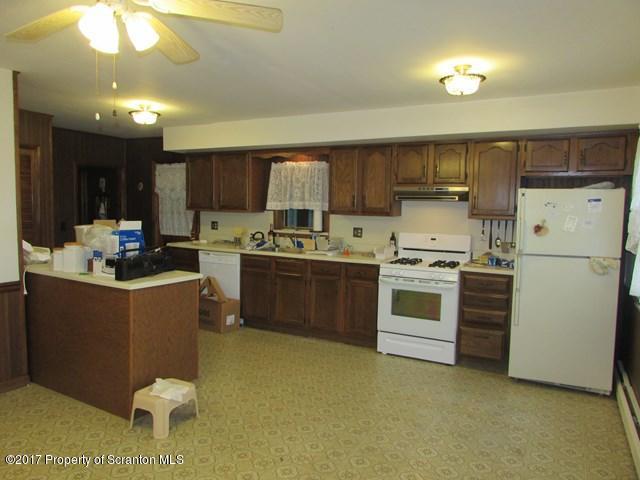 3948 Old Stage Coach Road Wyalusing, PA 18853 - Photo 5 of 19 a kitchen with a stove a refrigerator and a sink