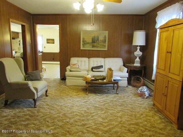 3948 Old Stage Coach Road Wyalusing, PA 18853 - Photo 8 of 19 a living room with furniture and a mirror