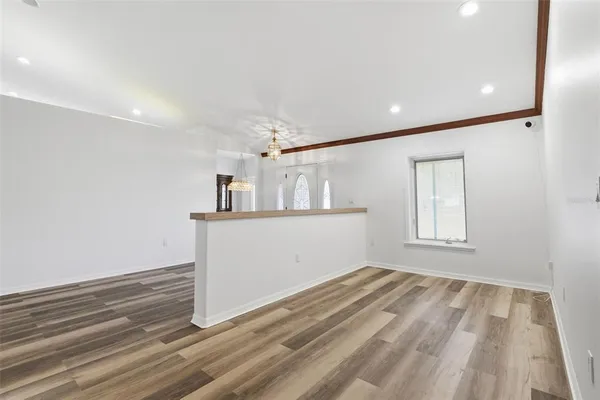 a living room with furniture a rug and a flat screen tv