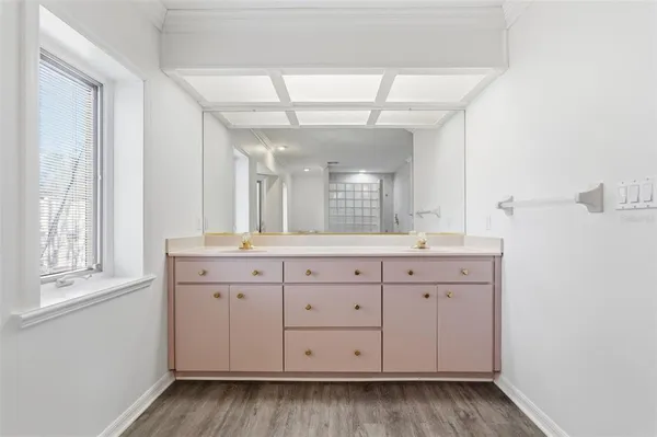 a kitchen with stainless steel appliances a sink a stove top oven a counter space and cabinets